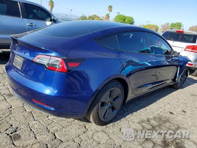 Trzecie zdjęcie samochodu z tyłu: 2023 TESLA MODEL 3 VIN:5YJ3E1EA6PF577889 - miniatura