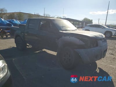 Czwarte zdjęcie samochodu z boku: 2001 NISSAN FRONTIER XE VIN:1N6ED27T51C403720 - miniatura