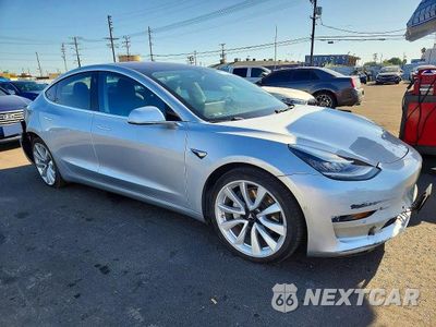 Czwarte zdjęcie samochodu z boku: 2018 TESLA MODEL 3 VIN:5YJ3E1EB7JF069172 - miniatura