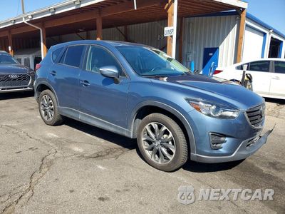 Czwarte zdjęcie samochodu z boku: 2016 MAZDA CX5 VIN:JM3KE4DY4G0871373 - miniatura