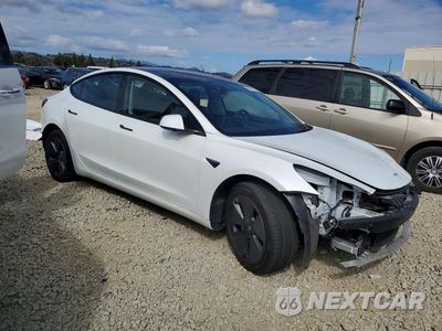 Czwarte zdjęcie samochodu z boku: 2023 TESLA MODEL 3 VIN:5YJ3E1EAXPF562523 - miniatura