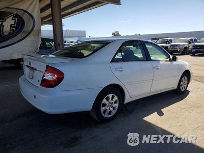 Trzecie zdjęcie samochodu z tyłu: 2003 TOYOTA CAMRY LE V6 VIN:JTDBF32K230131975 - miniatura