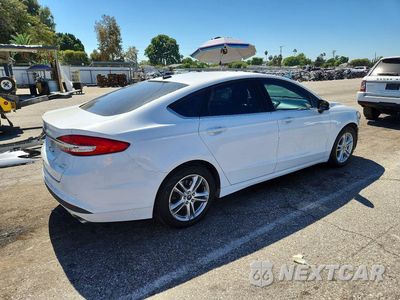 Trzecie zdjęcie samochodu z tyłu: 2018 FORD FUSION SE VIN:3FA6P0HD7JR276888 - miniatura