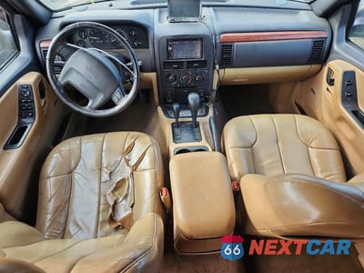 Zdjęcie 8 z 13 samochodu: 1999 JEEP GRAND CHEROKEE LAREDO VIN:1J4GW58S7XC678876 - miniatura