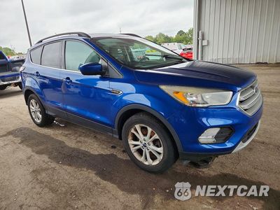 Czwarte zdjęcie samochodu z boku: 2018 FORD ESCAPE SE VIN:1FMCU9GD1JUA43038 - miniatura