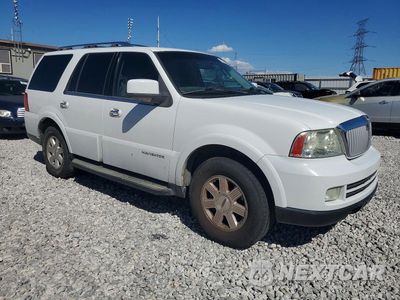 Czwarte zdjęcie samochodu z boku: 2012 LINCOLN NAVIGATOR VIN:5LMFU275X6LJ11084 - miniatura