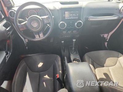 Zdjęcie 8 z 13 samochodu: 2015 JEEP WRANGLER UNLIMITED SAHARA VIN:1C4BJWEGXFL645437 - miniatura