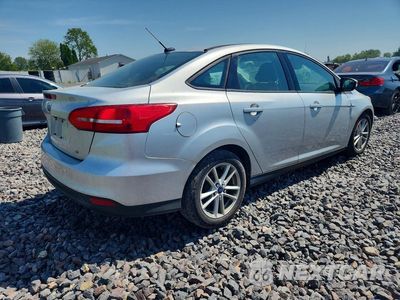 Trzecie zdjęcie samochodu z tyłu: 2017 FORD FOCUS SE VIN:1FADP3F23HL259363 - miniatura