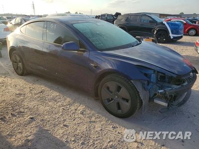 Czwarte zdjęcie samochodu z boku: 2023 TESLA MODEL 3 VIN:5YJ3E1EA7PF627411 - miniatura