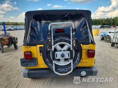 Zdjęcie 6 z 13 samochodu: 2000 JEEP WRANGLER / TJ SPORT VIN:1J4FA49S4YP754518 - miniatura