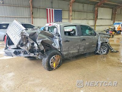 Trzecie zdjęcie samochodu z tyłu: 2021 GMC CANYON AT4 VIN:1GTG6FEN7M1106871 - miniatura