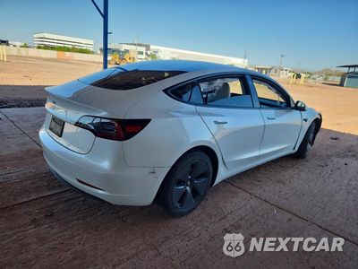Trzecie zdjęcie samochodu z tyłu: 2023 TESLA MODEL 3 VIN:5YJ3E1EA9PF692650 - miniatura