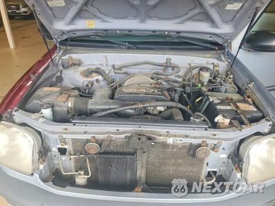Zdjęcie 11 z 12 samochodu: 2000 TOYOTA TUNDRA SR5 VIN:5TBBT4418YS103694 - miniatura