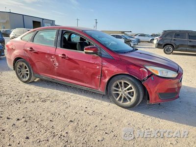 Czwarte zdjęcie samochodu z boku: 2016 FORD FOCUS SE VIN:1FADP3F22GL350963 - miniatura