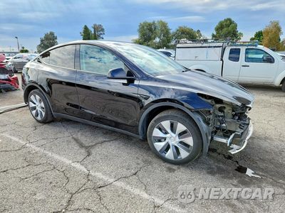 Czwarte zdjęcie samochodu z boku: 2023 TESLA MODEL Y VIN:7SAYGDEE1PA127443 - miniatura