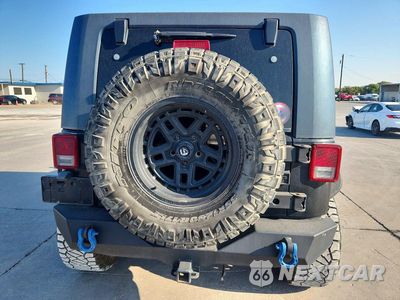 Zdjęcie 6 z 12 samochodu: 2009 JEEP WRANGLER UNLIMITED SAHARA VIN:1J4GA59149L760569 - miniatura