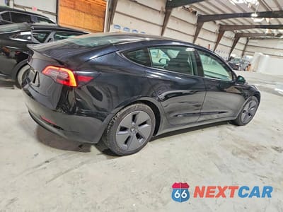 Trzecie zdjęcie samochodu z tyłu: 2022 TESLA MODEL 3 VIN:5YJ3E1EA9NF369003 - miniatura