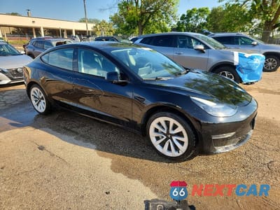 Czwarte zdjęcie samochodu z boku: 2022 TESLA MODEL 3 VIN:5YJ3E1EA0NF288813 - miniatura