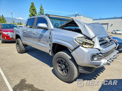 Czwarte zdjęcie samochodu z boku: 2019 TOYOTA TACOMA SR5 VIN:5TFAX5GN6KX163745 - miniatura