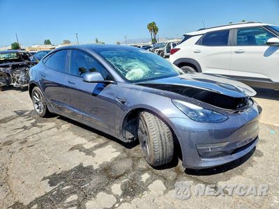 Czwarte zdjęcie samochodu z boku: 2022 TESLA MODEL 3 VIN:5YJ3E1EA4NF372990 - miniatura