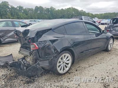 Trzecie zdjęcie samochodu z tyłu: 2023 TESLA MODEL 3 VIN:5YJ3E1EAXPF434718 - miniatura
