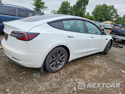 Trzecie zdjęcie samochodu z tyłu: 2021 TESLA MODEL 3 VIN:5YJ3E1EAXMF919419 - miniatura
