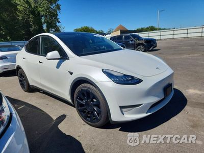 Czwarte zdjęcie samochodu z boku: 2023 TESLA MODEL Y VIN:7SAYGDEE5PA055145 - miniatura