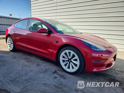 Czwarte zdjęcie samochodu z boku: 2022 TESLA MODEL 3 VIN:5YJ3E1EB2NF305104 - miniatura