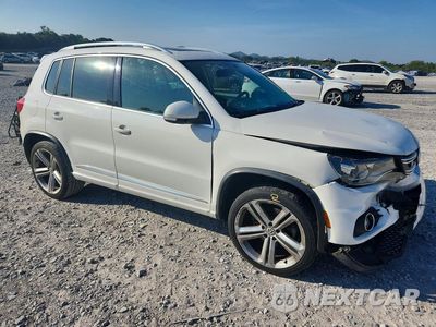 Czwarte zdjęcie samochodu z boku: 2014 VOLKSWAGEN TIGUAN S VIN:WVGAV3AX1EW013505 - miniatura
