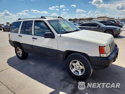 Czwarte zdjęcie samochodu z boku: 1996 JEEP GRAND CHEROKEE LAREDO VIN:1J4FX58S8TC398824 - miniatura