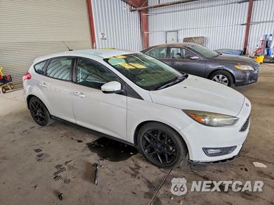 Czwarte zdjęcie samochodu z boku: 2016 FORD FOCUS SE VIN:1FADP3K2XGL256013 - miniatura