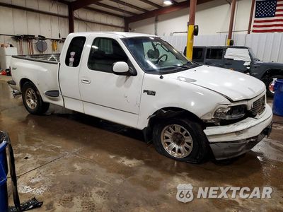 Czwarte zdjęcie samochodu z boku: 2003 FORD F150 VIN:1FTRX07243KD55806 - miniatura