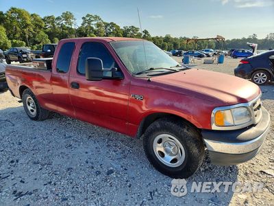 Czwarte zdjęcie samochodu z boku: 2001 FORD F150 VIN:1FTZX17211KA06590 - miniatura