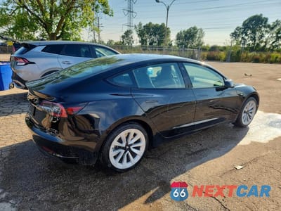 Trzecie zdjęcie samochodu z tyłu: 2022 TESLA MODEL 3 VIN:5YJ3E1EA0NF288813 - miniatura