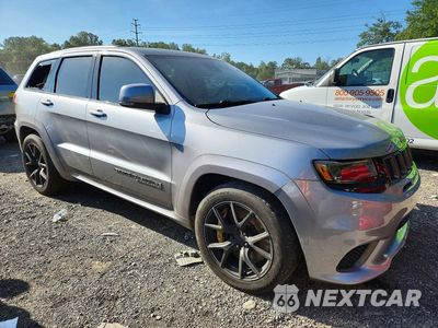Czwarte zdjęcie samochodu z boku: 2018 JEEP GRAND CHEROKEE TRACKHAWK VIN:1C4RJFN9XJC266611 - miniatura