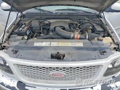 Zdjęcie 11 z 12 samochodu: 1999 FORD F150 VIN:1FTRX17W0XKB74913 - miniatura