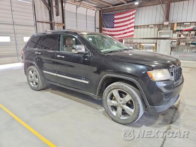 Czwarte zdjęcie samochodu z boku: 2013 JEEP GRAND CHEROKEE OVERLAND VIN:1C4RJFCG6DC581475 - miniatura