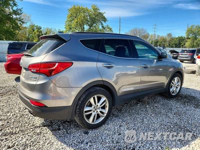 Trzecie zdjęcie samochodu z tyłu: 2014 HYUNDAI SANTA FE SPORT 2.0T VIN:5XYZUDLA0EG210901 - miniatura