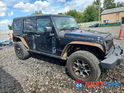 Czwarte zdjęcie samochodu z boku: 2014 JEEP WRANGLER UNLIMITED RUBICON VIN:1C4BJWFG7EL145104 - miniatura