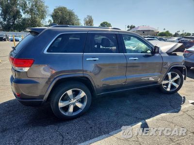Trzecie zdjęcie samochodu z tyłu: 2014 JEEP GRAND CHEROKEE OVERLAND VIN:1C4RJECM1EC581448 - miniatura