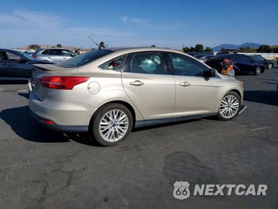 Trzecie zdjęcie samochodu z tyłu: 2017 FORD FOCUS TITANIUM VIN:1FADP3J24HL279838 - miniatura