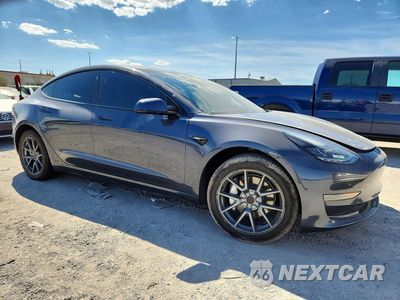 Czwarte zdjęcie samochodu z boku: 2023 TESLA MODEL 3 VIN:5YJ3E1EA6PF412151 - miniatura
