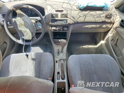 Zdjęcie 8 z 13 samochodu: 2001 TOYOTA COROLLA CE VIN:1NXBR12E21Z544826 - miniatura