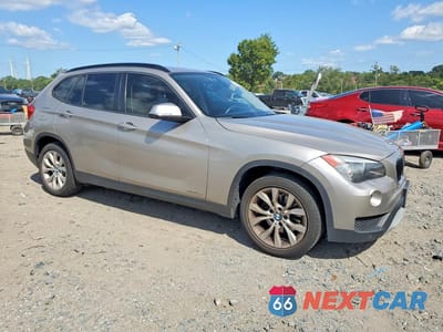 Czwarte zdjęcie samochodu z boku: 2014 BMW X1 XDRIVE28I VIN:WBAVL1C51EVY21142 - miniatura
