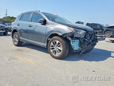 Czwarte zdjęcie samochodu z boku: 2018 TOYOTA RAV4 HYBRID LE VIN:JTMRJREV2JD191699 - miniatura