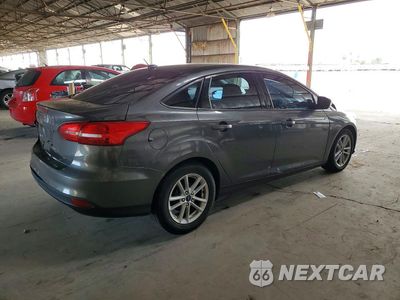 Trzecie zdjęcie samochodu z tyłu: 2017 FORD FOCUS SE VIN:1FADP3F21HL303764 - miniatura