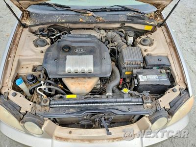 Zdjęcie 11 z 12 samochodu: 2004 KIA OPTIMA LX VIN:KNAGD126445366608 - miniatura