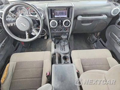 Zdjęcie 8 z 13 samochodu: 2010 JEEP WRANGLER UNLIMITED SAHARA VIN:1J4HA5H13AL198349 - miniatura