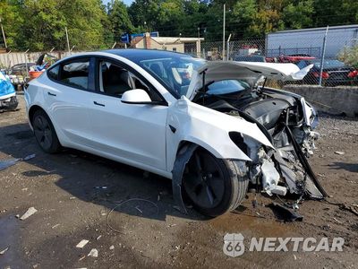 Czwarte zdjęcie samochodu z boku: 2023 TESLA MODEL 3 VIN:5YJ3E1EA6PF471023 - miniatura