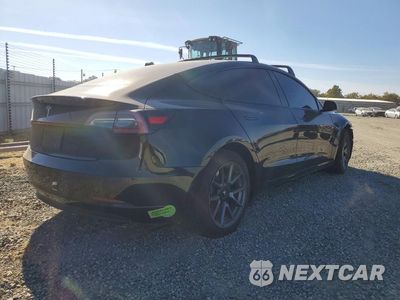 Trzecie zdjęcie samochodu z tyłu: 2023 TESLA MODEL 3 VIN:5YJ3E1EA3PF549578 - miniatura
